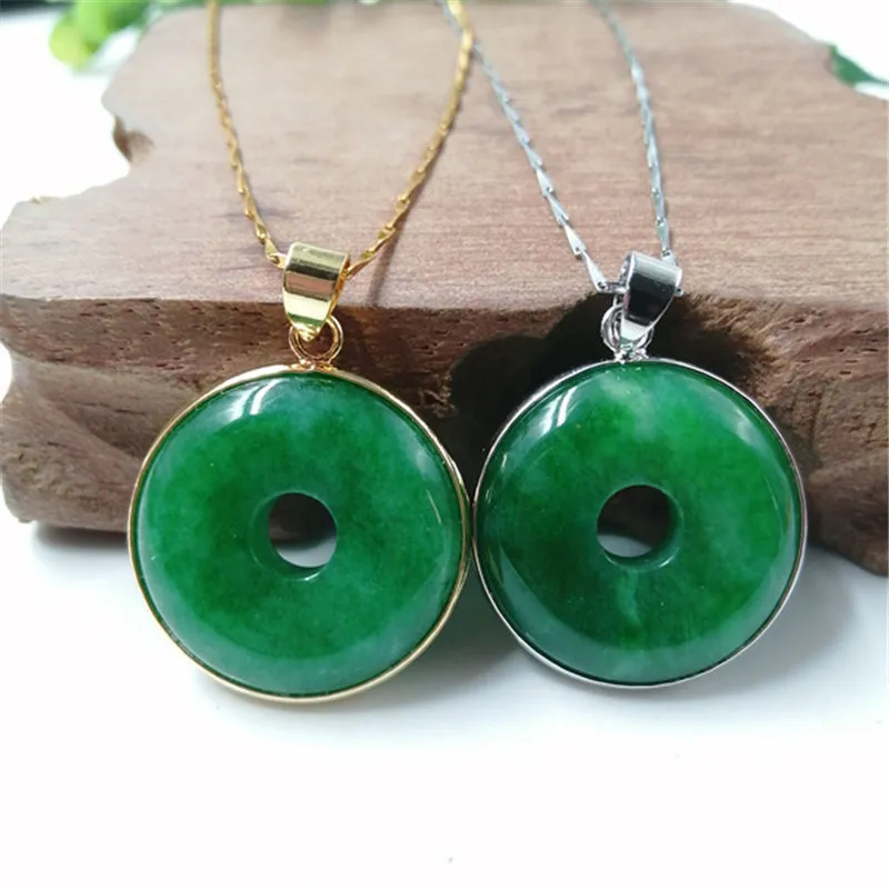 Emerald round jade pendant with gold inlaid safety buckle, modern simple geometry style, on a neutral background