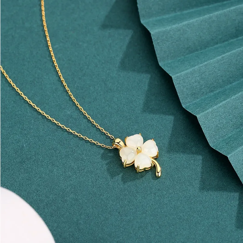 Women's four-leaf clover necklace with Hetian jade pendant on an adjustable sterling silver chain.