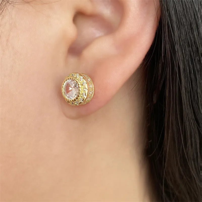 Round copper stud earrings with inlaid zircon in gold tone on white background