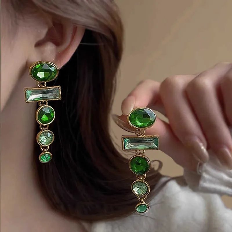A pair of green gradient geometric earrings with an inlaid zircon stone in a Chinese style.
