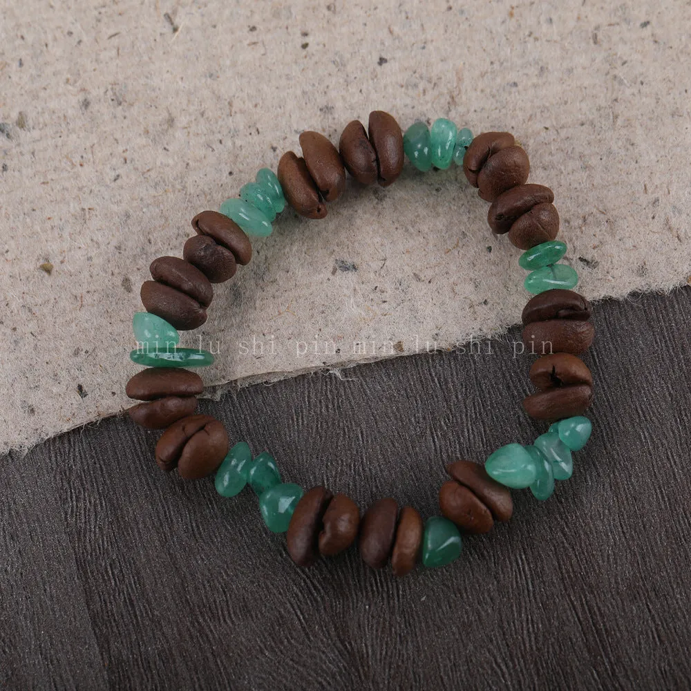 Handmade coffee bean bracelet with 16mm geometric charm showing colour variations