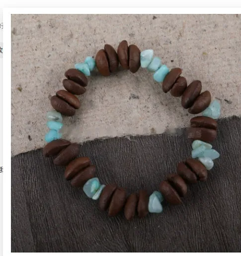 Handmade coffee bean bracelet with 16mm geometric charm showing colour variations