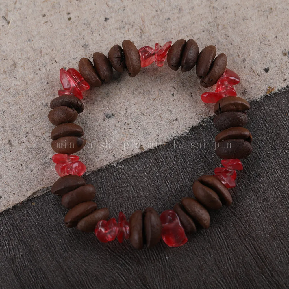Handmade coffee bean bracelet with 16mm geometric charm showing colour variations