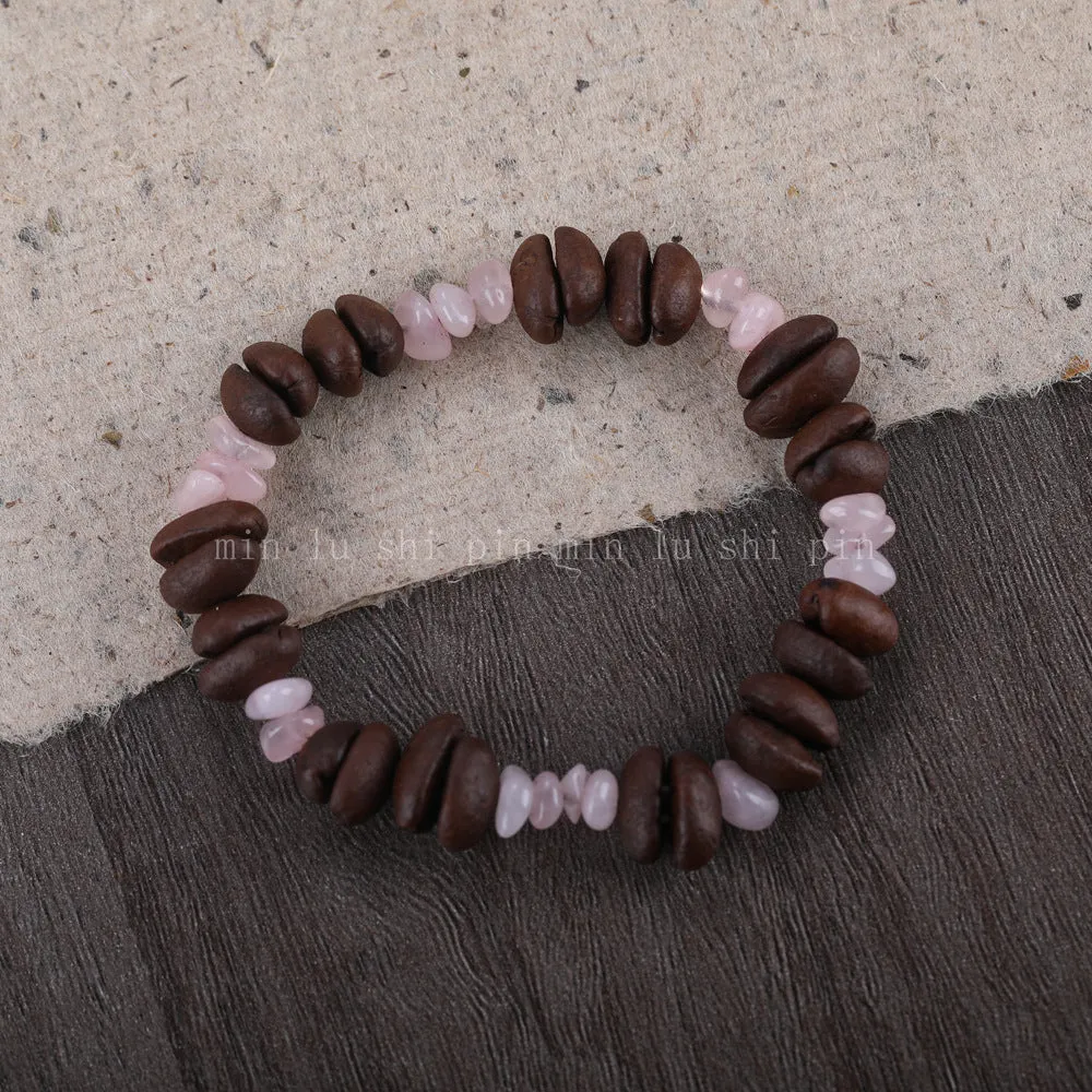 Handmade coffee bean bracelet with 16mm geometric charm showing colour variations