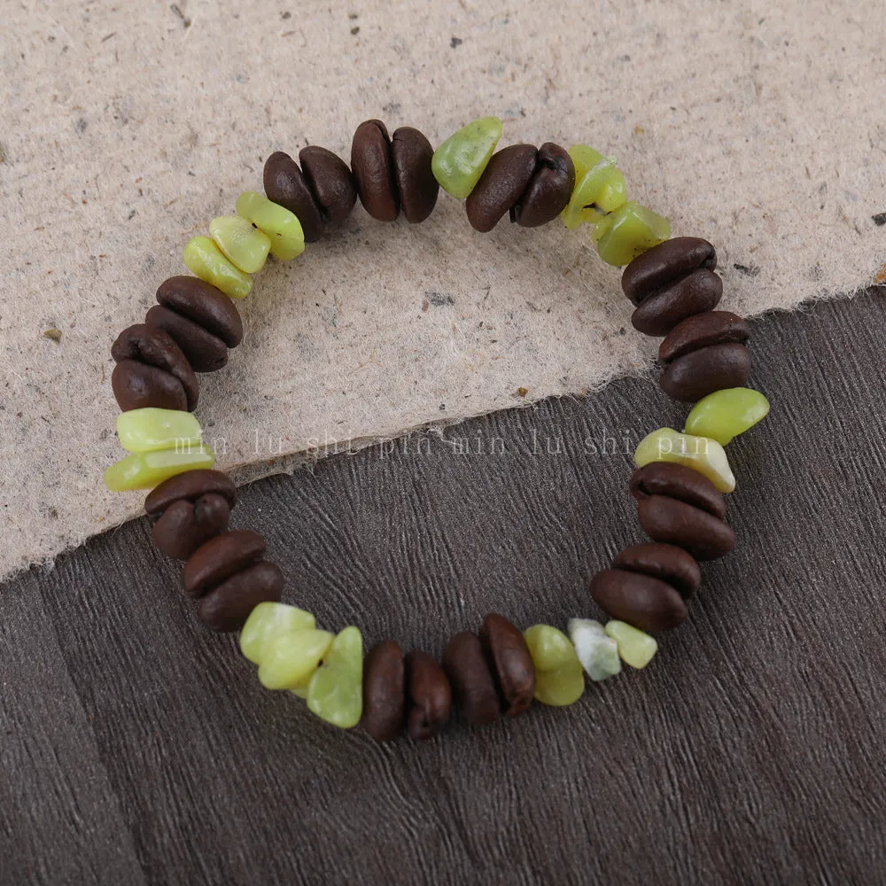 Handmade coffee bean bracelet with 16mm geometric charm showing colour variations