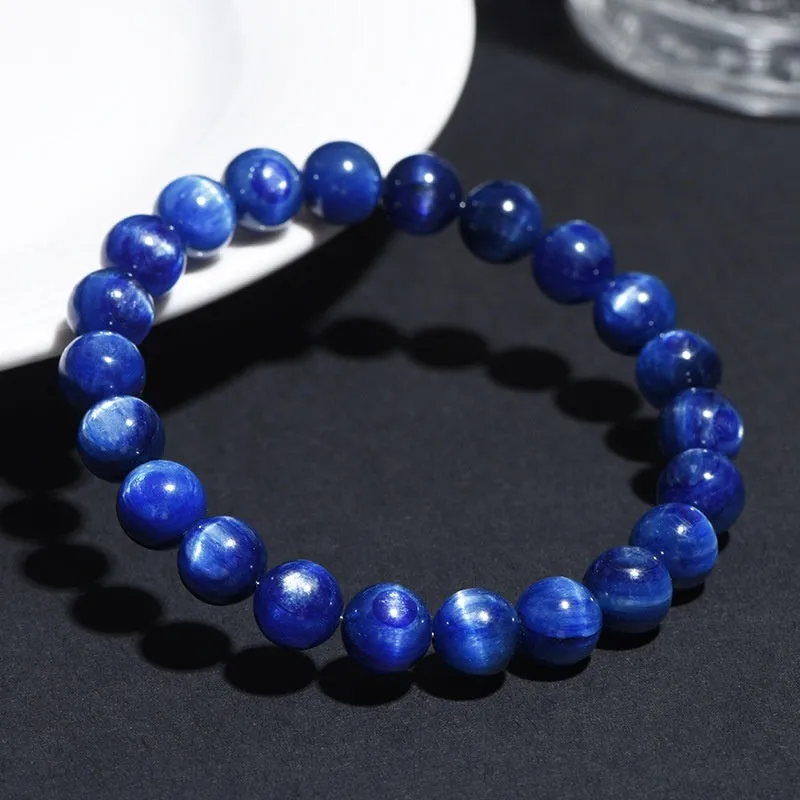 Natural blue crystal ball bracelet with geometric shape and Ruyi design on a white background.
