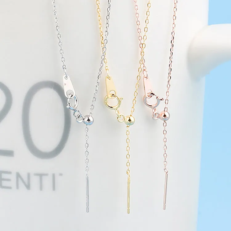Stainless steel necklace with a U-shaped pendant on a chain, shown in steel, gold, and rose gold colour options.