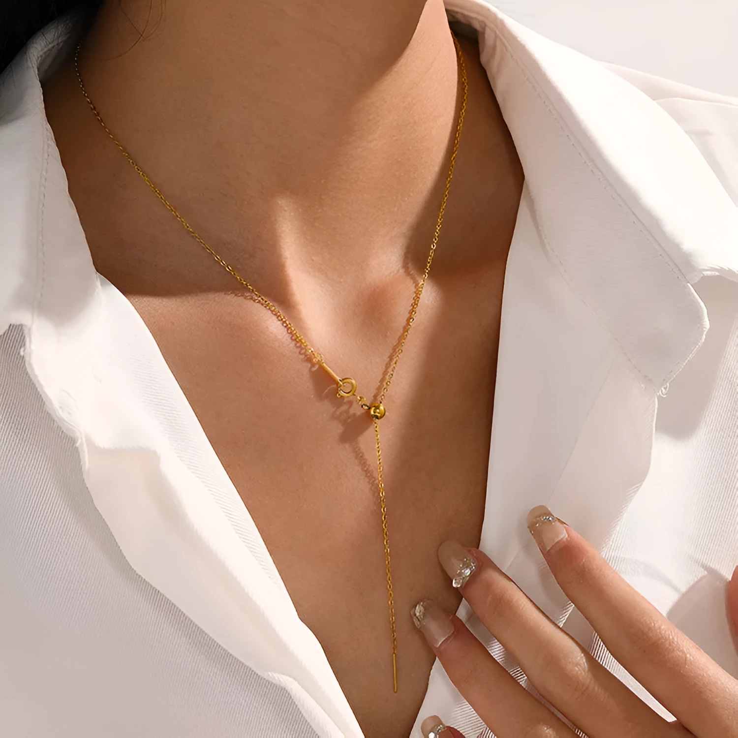 Stainless steel necklace with a U-shaped pendant on a chain, shown in steel, gold, and rose gold colour options.