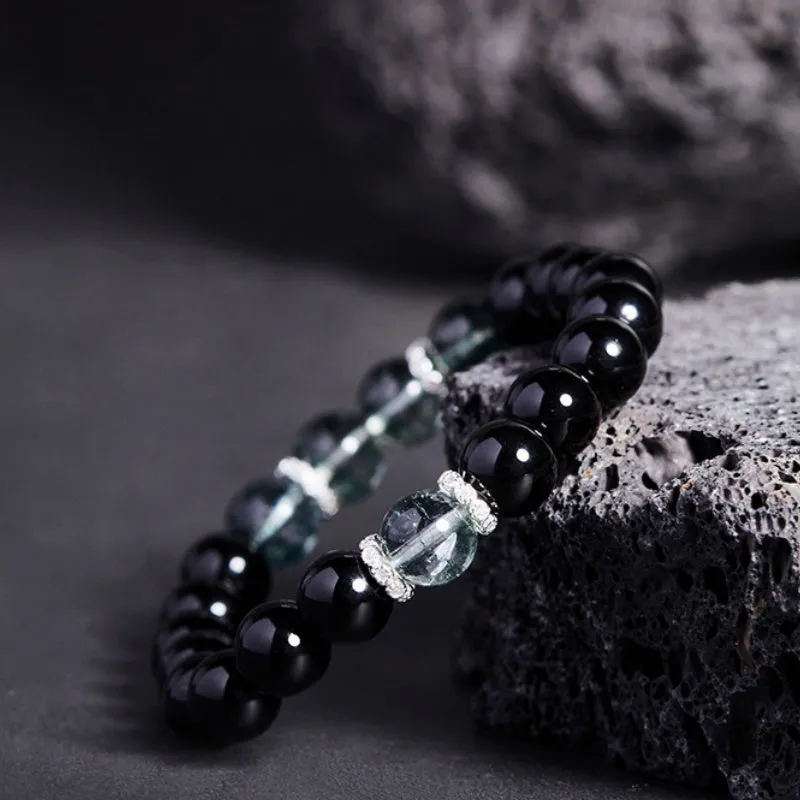 Chinese style black geometric bead bracelet with sterling silver components on wrist
