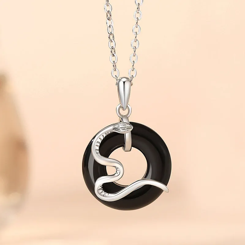 925 sterling silver snake couple necklace with Peace buckle on black background