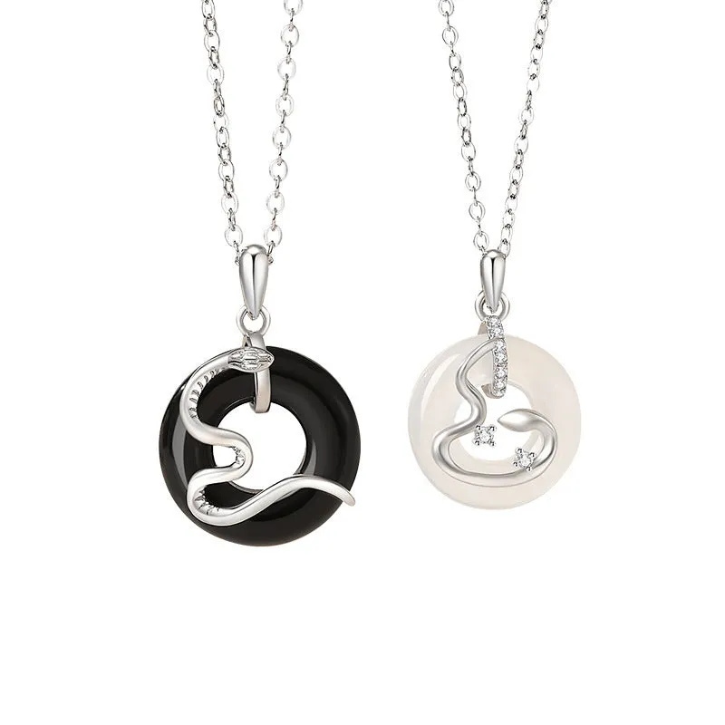 925 sterling silver snake couple necklace with Peace buckle on black background