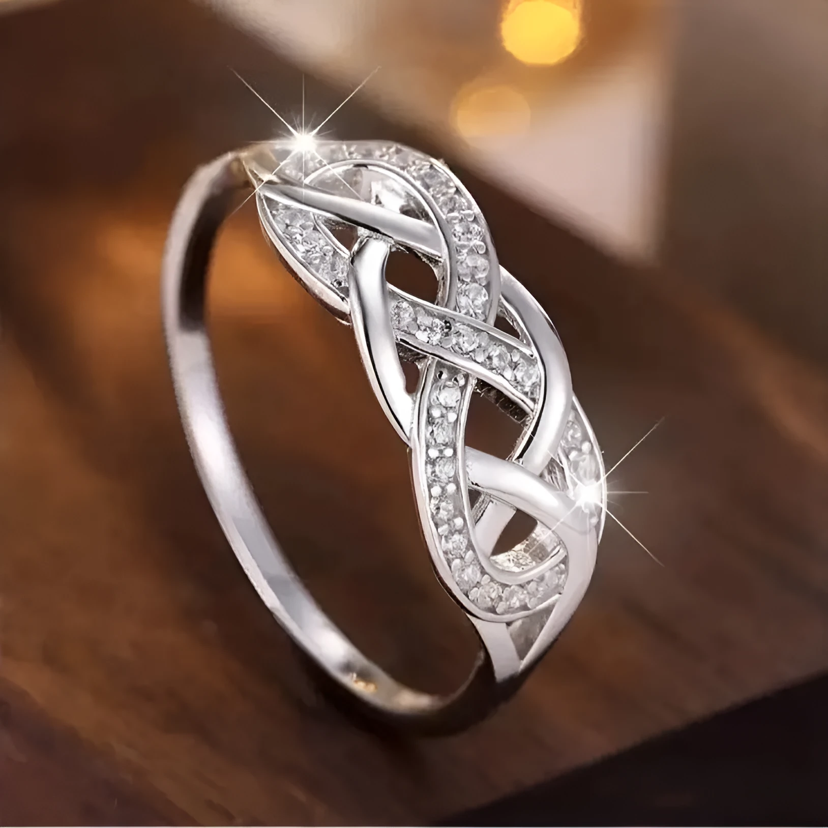 Multi-layer winding hollow geometric twist ring in white gold finish with inlaid zircon, copper base, sizes No 6 to No 10