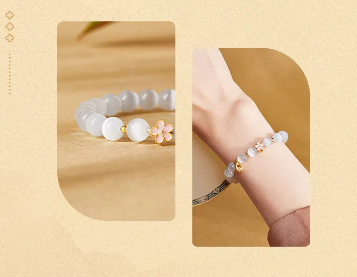 Sterling silver character fu bag bracelet with cold enamel peach blossom opal, flower shape, Gray Island Peach Blossom style, on white background