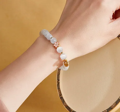 Sterling silver character fu bag bracelet with cold enamel peach blossom opal, flower shape, Gray Island Peach Blossom style, on white background