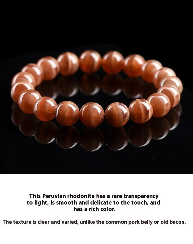 Natural Old Mine Rhodochrosite round bead bracelet on wrist, showing manganese spar colour.