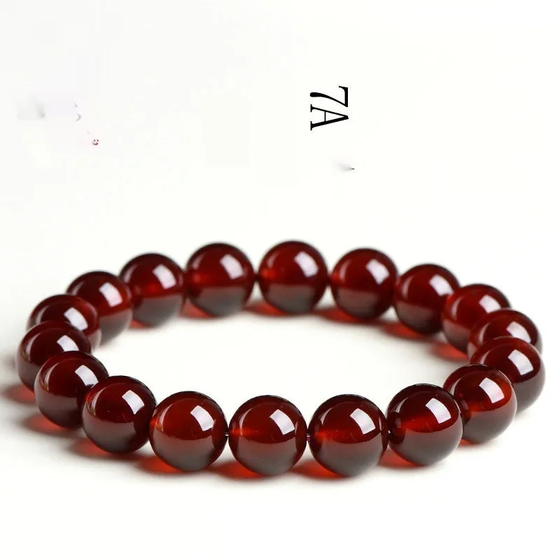 Natural orange red garnet ball bracelet with Ruyi design elements on crystal beads