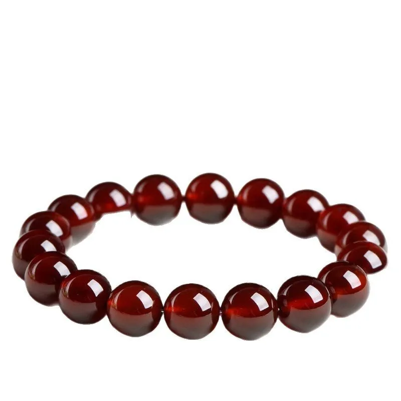 Natural orange red garnet ball bracelet with Ruyi design elements on crystal beads