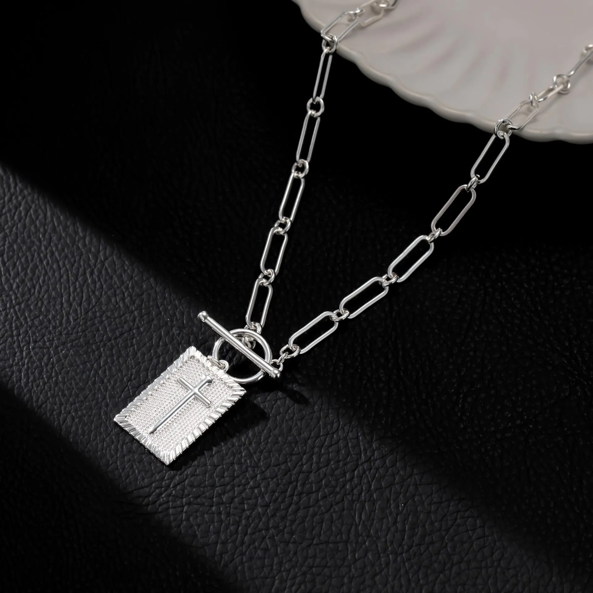 Gold stainless steel clip necklace with cross and square pendant on clip chain