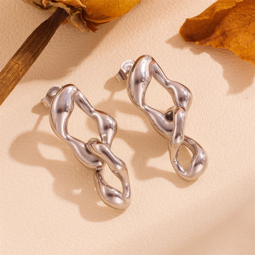 Heart shape titanium steel earrings in gold leaf style on white background