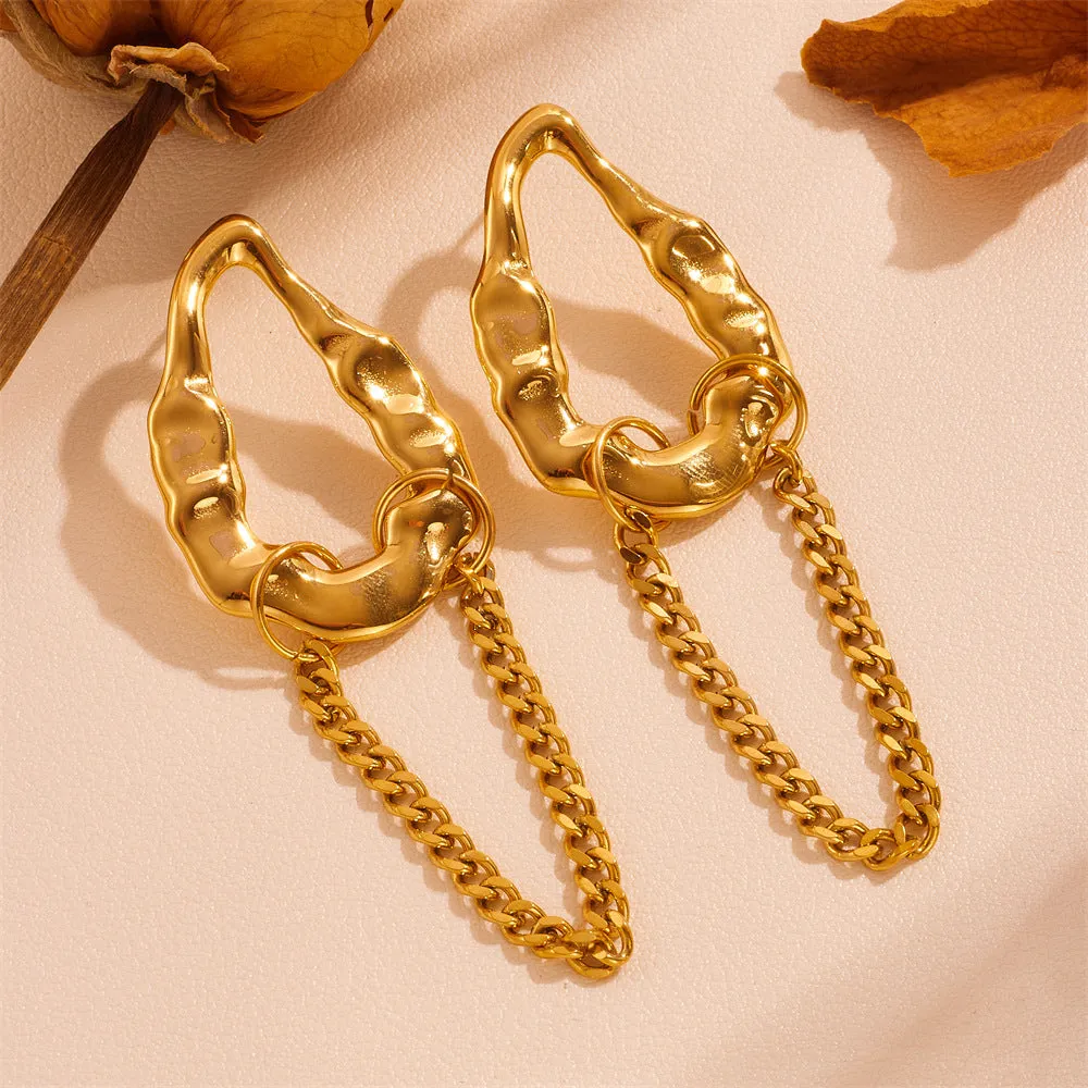Heart shape titanium steel earrings in gold leaf style on white background
