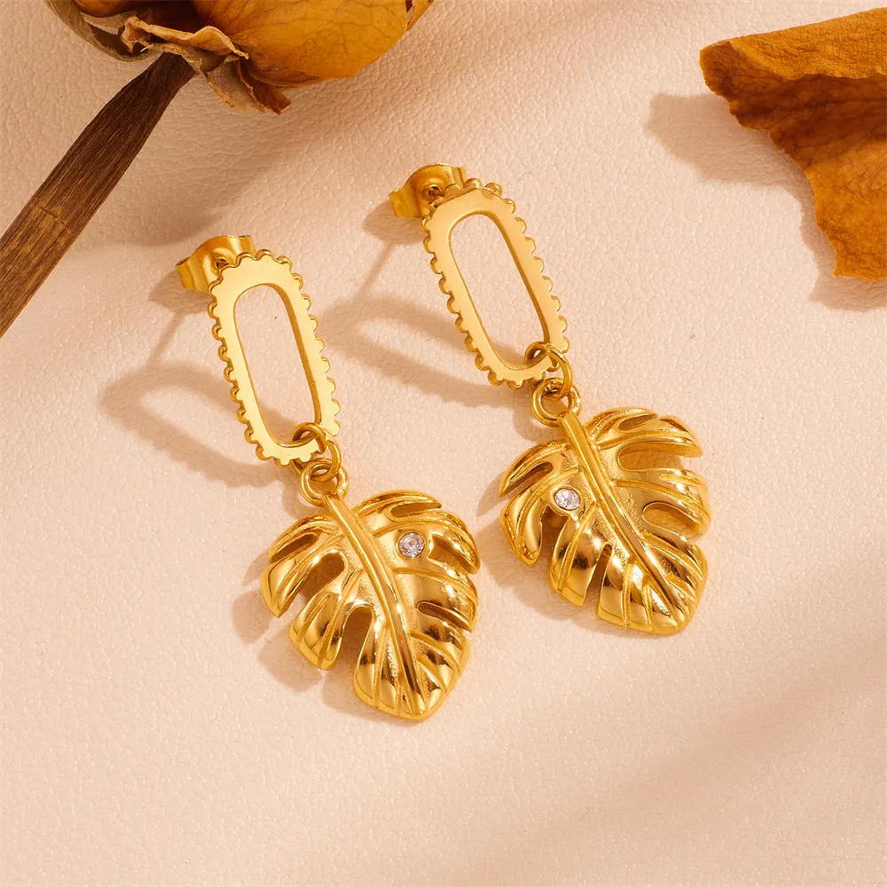 Heart shape titanium steel earrings in gold leaf style on white background