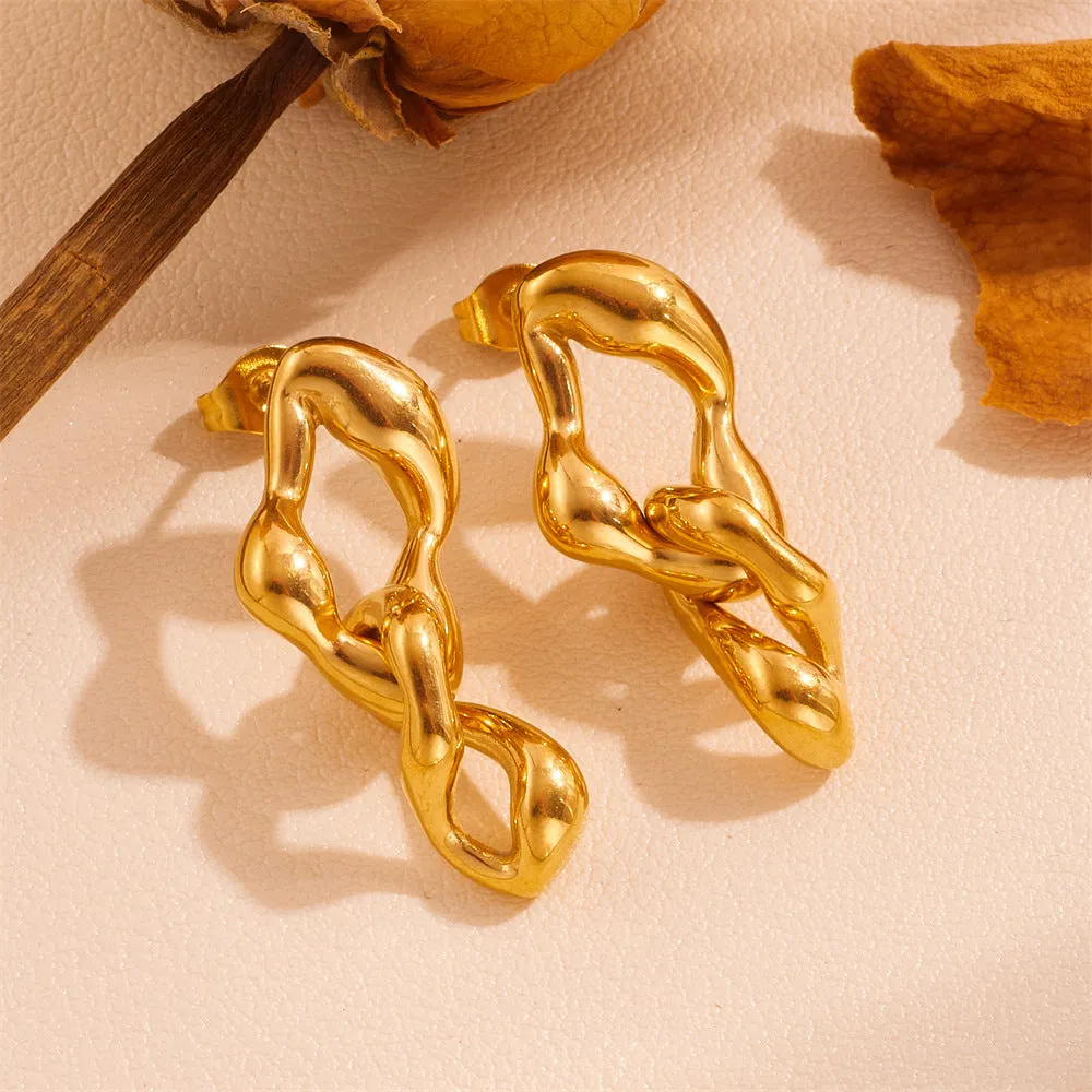Heart shape titanium steel earrings in gold leaf style on white background