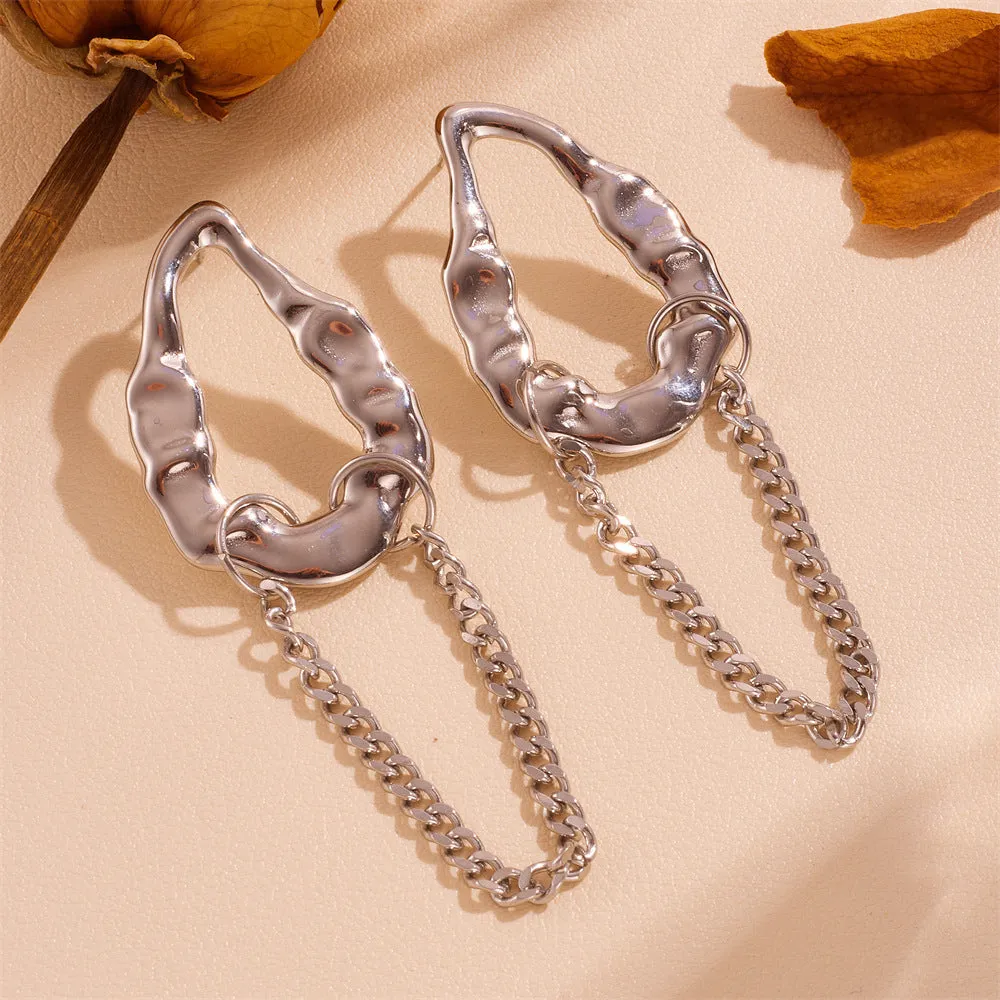 Heart shape titanium steel earrings in gold leaf style on white background