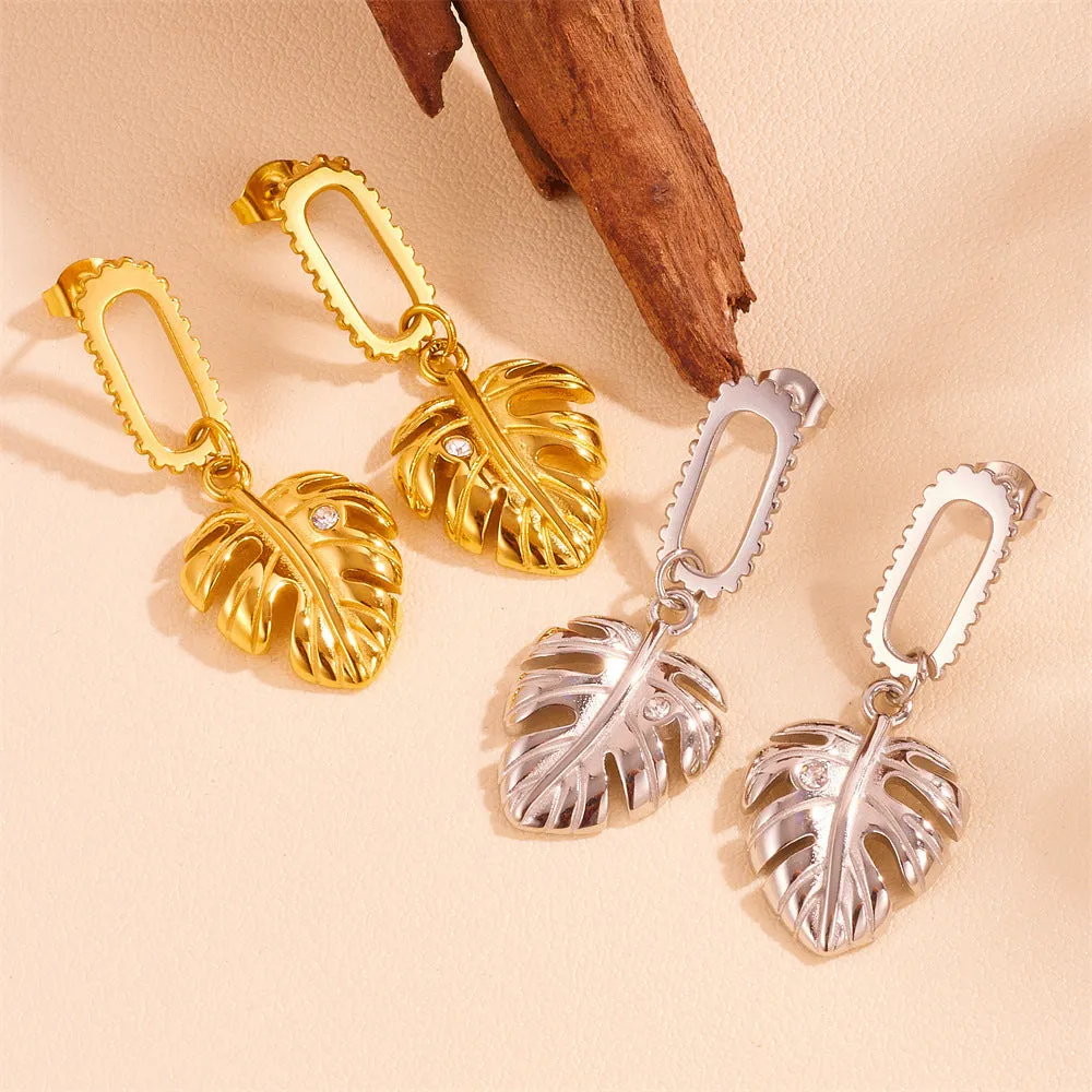 Heart shape titanium steel earrings in gold leaf style on white background