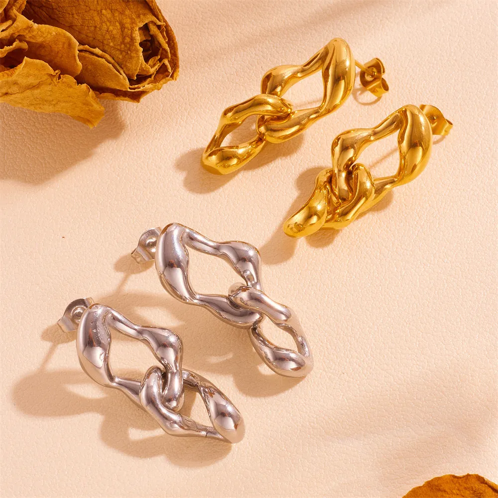 Heart shape titanium steel earrings in gold leaf style on white background