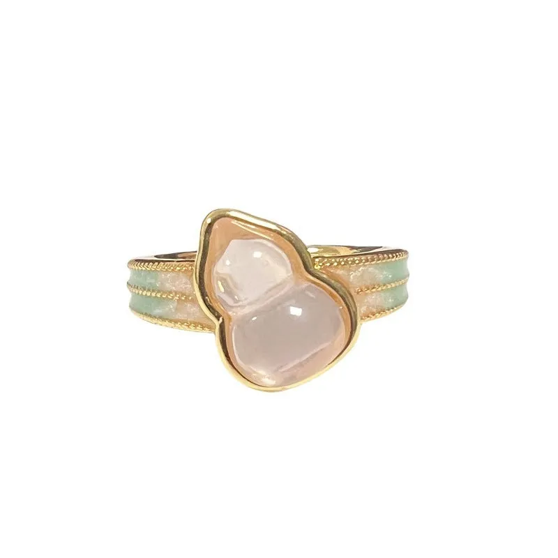 A copper vintage-style ring with a gourd motif, floral and bow designs, inlaid zircon stones, and an adjustable opening.
