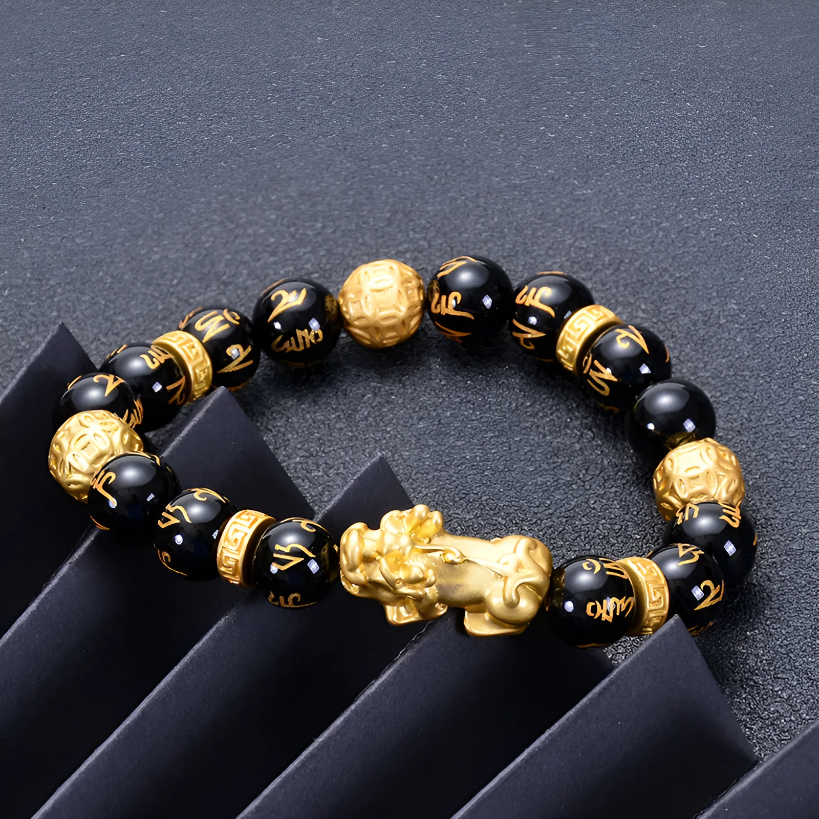 Unisex natural black agate stone bracelet with imitation gold accent, round bead design