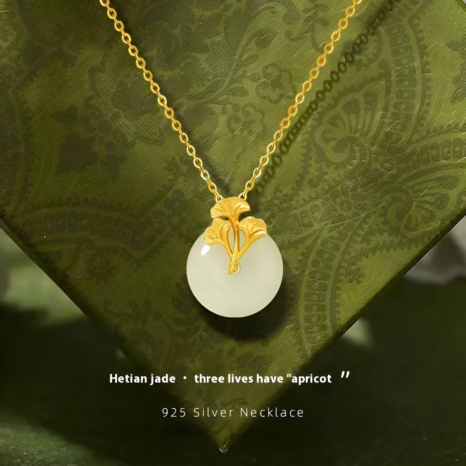 925 sterling silver ginkgo leaf pendant necklace, gold finish, with peace buckle and adjustable 41-50 cm chain on model clavicle