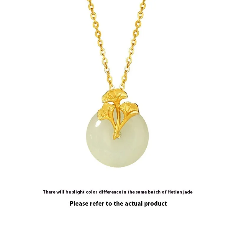 925 sterling silver ginkgo leaf pendant necklace, gold finish, with peace buckle and adjustable 41-50 cm chain on model clavicle