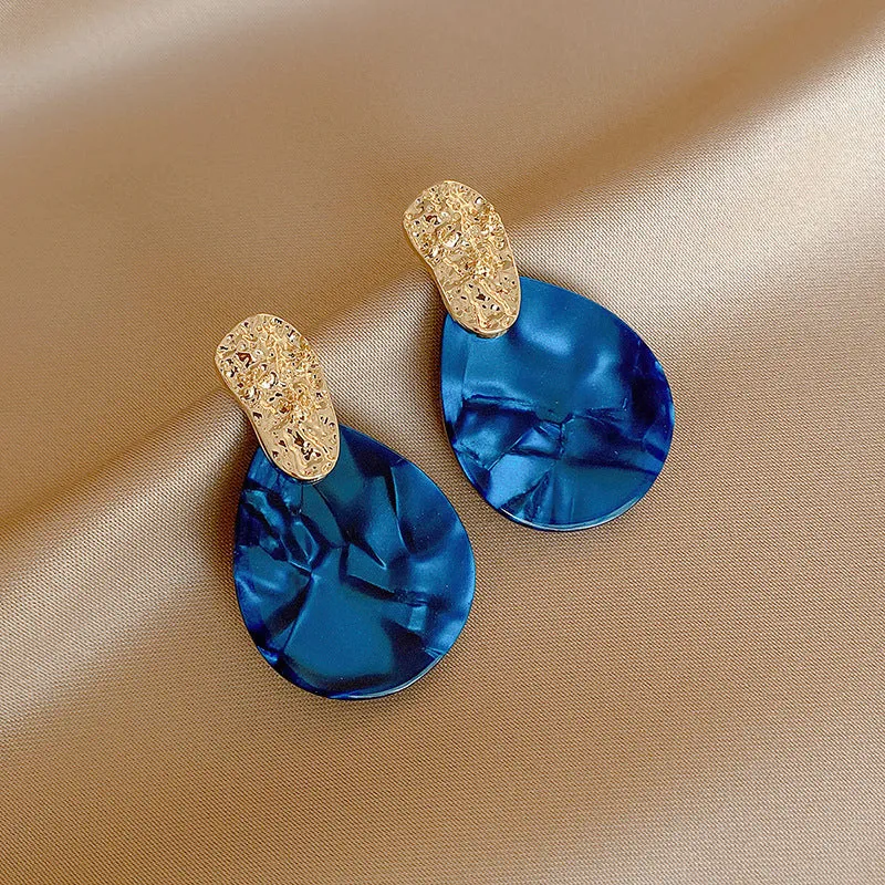 Silver Needle blue acrylic water drop ear studs with pleated texture on white background