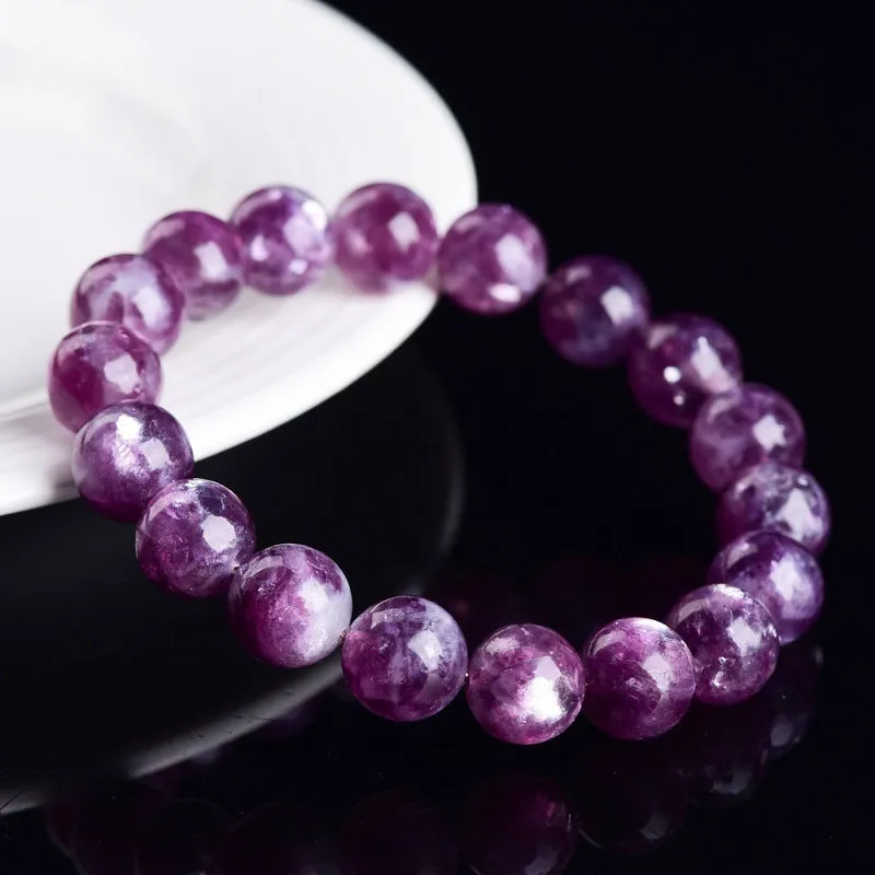 Grandmother crystal bracelet with polished geometric beads in purple on a wrist.