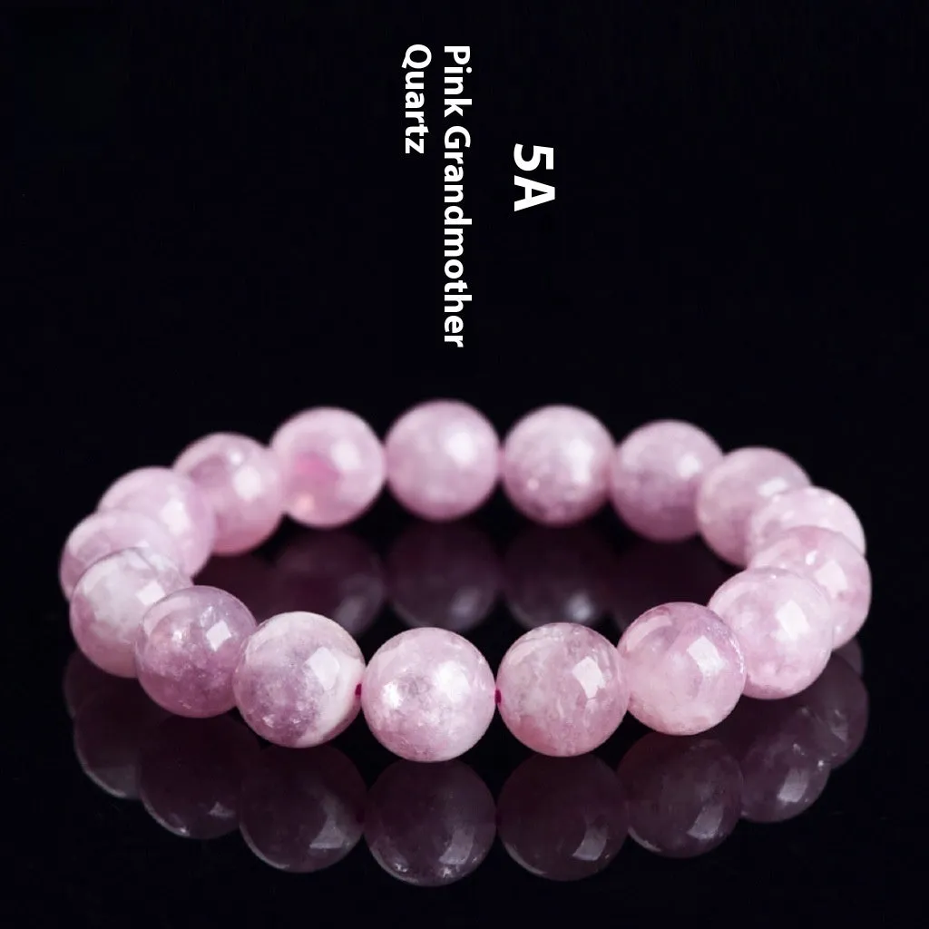 Grandmother crystal bracelet with polished geometric beads in purple on a wrist.