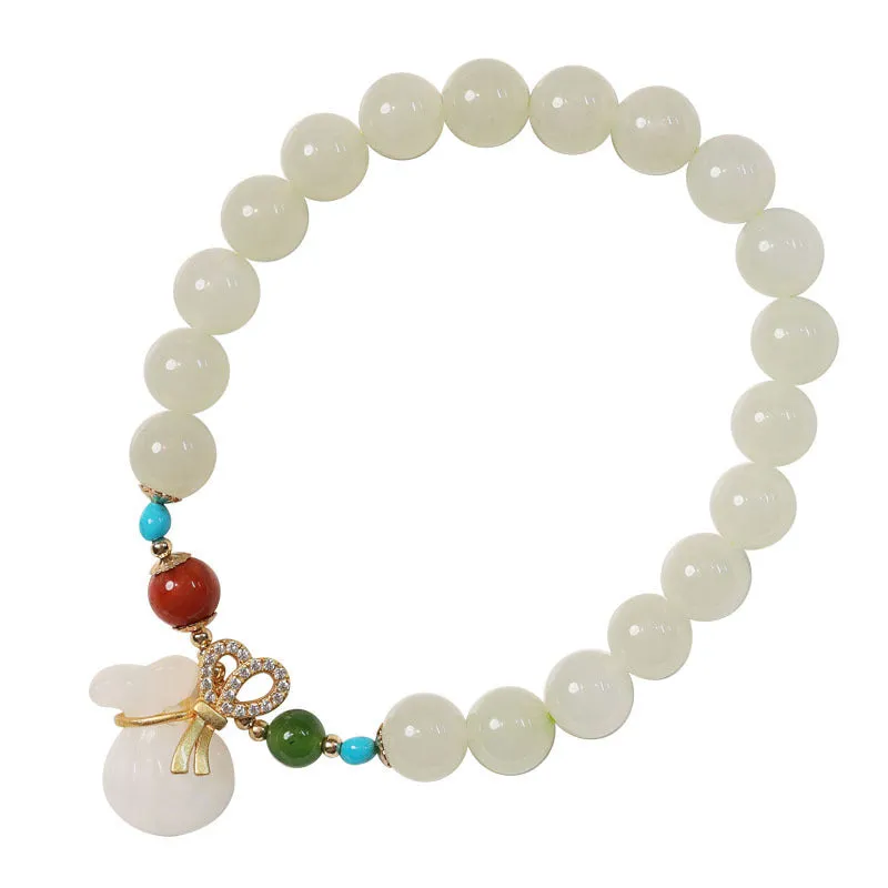8mm natural Hetian gray jade round bead bracelet on women's wrist, retro style