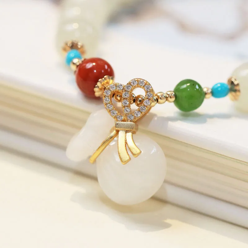 8mm natural Hetian gray jade round bead bracelet on women's wrist, retro style