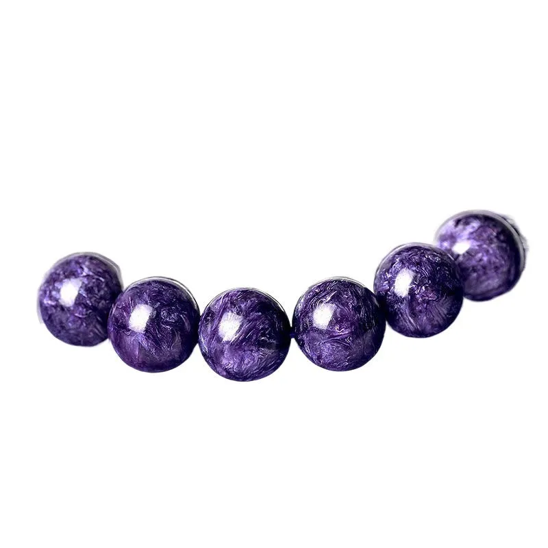 Natural transparent charoite crystal bracelet with platinum setting, showing different bead size options on a wrist.