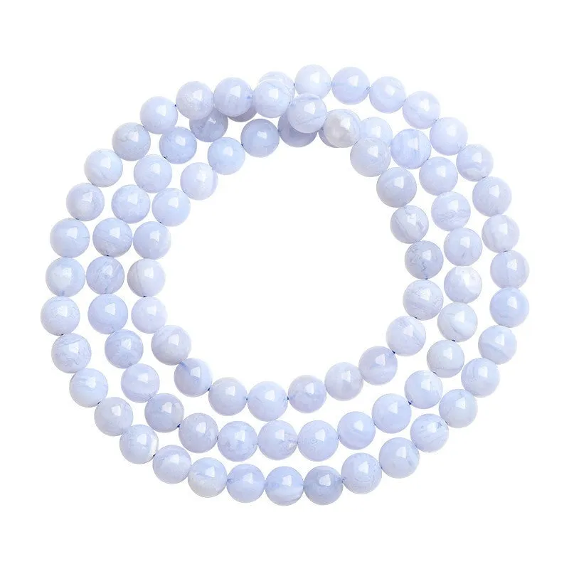 Blue agate bracelet with Ruyi symbol and scattered beads measuring 6-6.8mm.