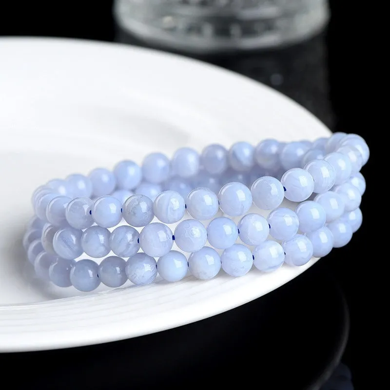 Blue agate bracelet with Ruyi symbol and scattered beads measuring 6-6.8mm.