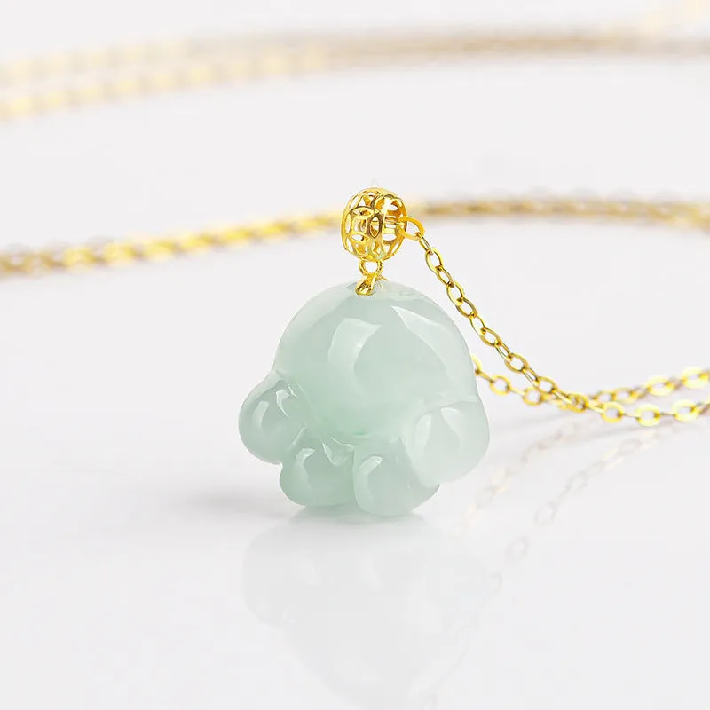 Emerald light green jade cat's paw pendant with 18K gold buckle and certificate on a white background