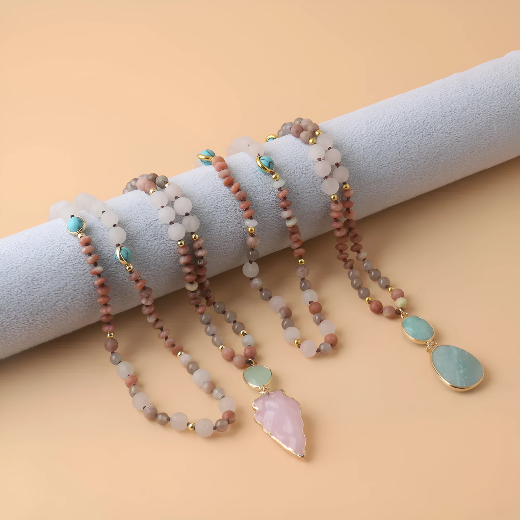 Unisex natural stone beaded necklace with round beads in pink and green colour options on white background
