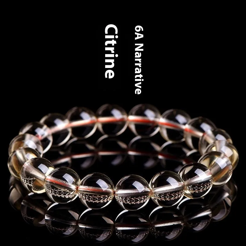 Natural citrine scattered beads ball bracelet in 7A and 6A colour grades on a wrist.