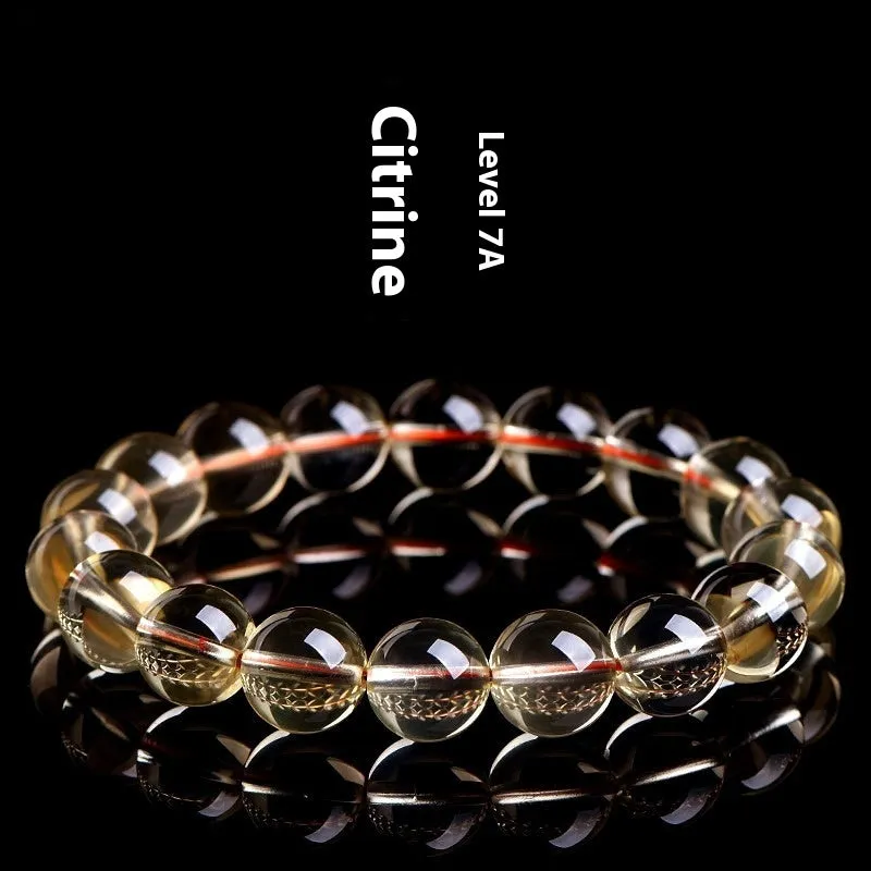 Natural citrine scattered beads ball bracelet in 7A and 6A colour grades on a wrist.
