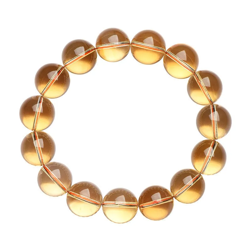Natural citrine scattered beads ball bracelet in 7A and 6A colour grades on a wrist.