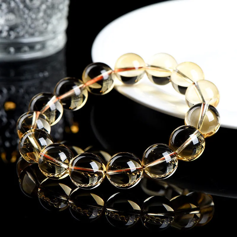 Natural citrine scattered beads ball bracelet in 7A and 6A colour grades on a wrist.