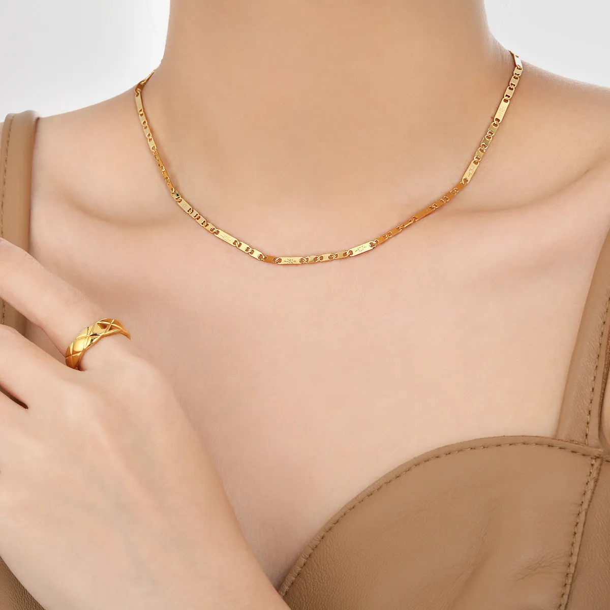 Gold electroplated titanium steel necklace with hammer pattern and Chinese character pendant on a stud chain