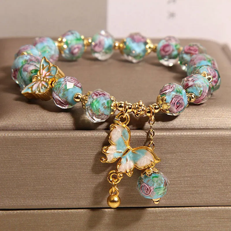 Women's rose garden bracelet with coloured glaze butterfly charm in blue, Japanese Korean style