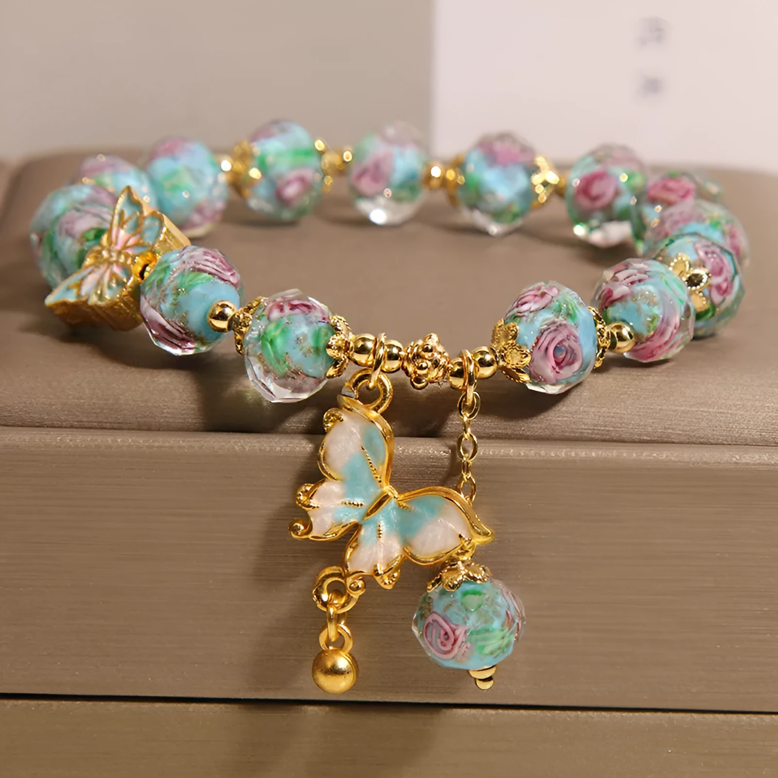 Women's rose garden bracelet with coloured glaze butterfly charm in blue, Japanese Korean style